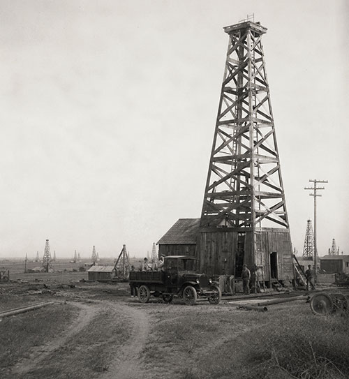 Early oilfield with car